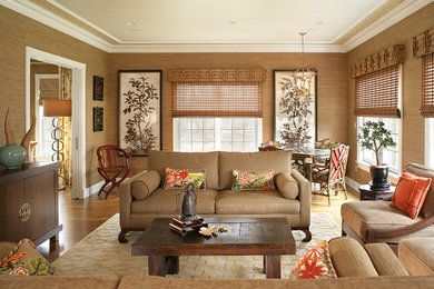 Design ideas for a large asian enclosed family room in New York with beige walls, medium hardwood floors and no fireplace.