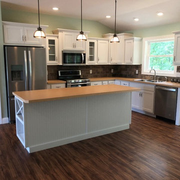 New Construction Milan, IL Koch Express Painted White Formica Amber Maple