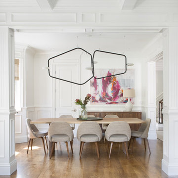 Modern Dining Room with Sculptural Chandelier and Vibrant Art