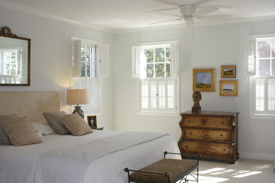 Example of a mid-sized classic master carpeted bedroom design in Raleigh with white walls and no fireplace