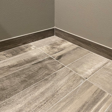 BATHROOM - New Tub, 12x24 Brown Tile, Gray Plank Floor Tile, Tebas Black Granite