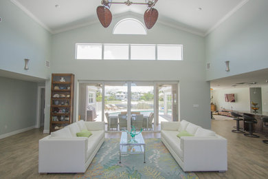 Mid-sized transitional open concept porcelain tile and black floor living room photo in Miami