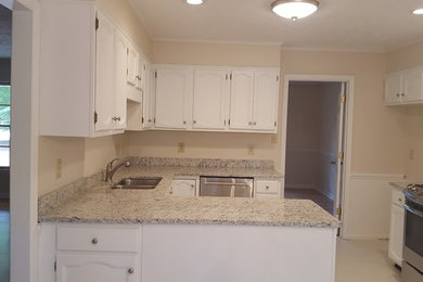 Mid-sized elegant ceramic tile and white floor eat-in kitchen photo in Raleigh with white cabinets and granite countertops