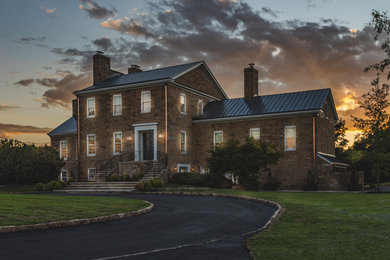 Large country three-story exterior home photo in DC Metro