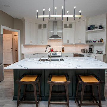3 Finishes on Kitchen Cabinetry with Galley Workstation in Island and Wine Bar