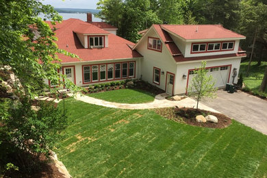 Mid-sized traditional white two-story wood exterior home idea in Other