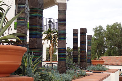 Photo of a huge modern partial sun backyard stone garden path in Orange County.