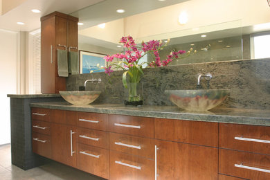 Inspiration for a mid-sized contemporary master blue tile and stone slab porcelain tile and beige floor doorless shower remodel in San Diego with a vessel sink, flat-panel cabinets, medium tone wood cabinets, granite countertops, an undermount tub, a one-piece toilet and white walls