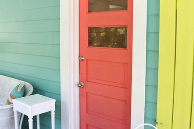 Mid-sized eclectic entryway photo in Vancouver with a red front door and blue walls