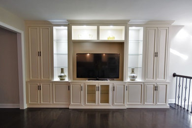 Example of a mid-sized tuscan open concept dark wood floor and brown floor living room design in DC Metro with gray walls, no fireplace and a tv stand