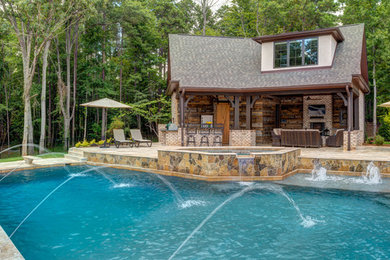 Pool - rustic backyard custom-shaped pool idea in Charlotte