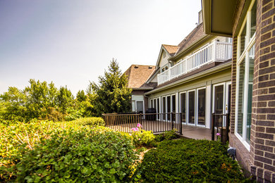 Example of a small trendy backyard deck design in Other with no cover