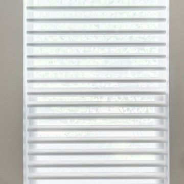 Lowered and open Hunter Douglas Pirouette Window Shadings with PowerView®