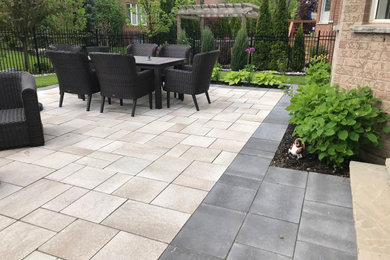 Inspiration for a concrete paver patio remodel in Toronto