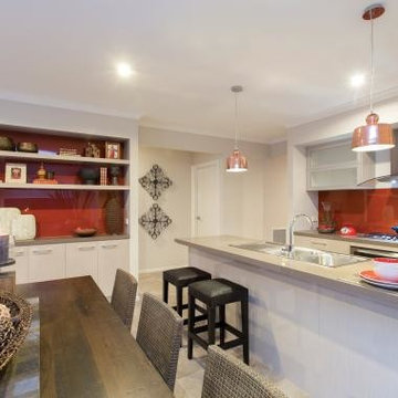 Epping, built-in custom cabinetry to Dining Room with red glass splashba
