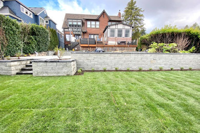 Photo of a craftsman stone fence landscaping in Seattle.