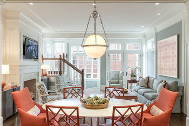 Family room - large eclectic open concept medium tone wood floor family room idea in Chicago with a standard fireplace, a stone fireplace and a wall-mounted tv