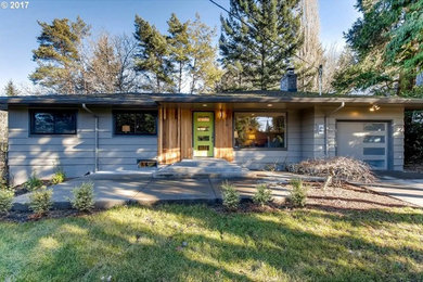 Mid-sized 1950s gray one-story wood exterior home photo in Portland with a shingle roof