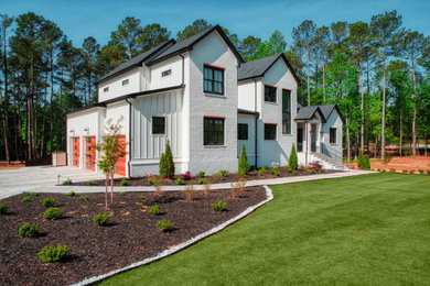 Inspiration for a white brick detached house in Atlanta with three floors, a pitched roof, a shingle roof and a black roof.