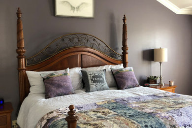 Bedroom - large modern master bedroom idea in Detroit with purple walls