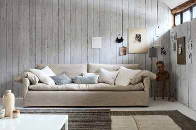 Design ideas for a large rustic formal enclosed living room in Surrey with white walls, painted wood flooring, no fireplace and no tv.