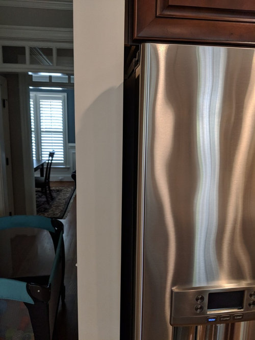 Refrigerator next to wall hinges?