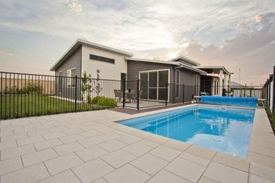 Inspiration for a contemporary house exterior remodel in Other