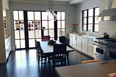 Photo of a contemporary kitchen in Bridgeport with marble benchtops, stone slab splashback and medium hardwood floors.