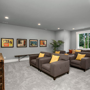 Elegant enclosed carpeted and gray floor home theater photo in Seattle with gray walls and a wall-mounted tv