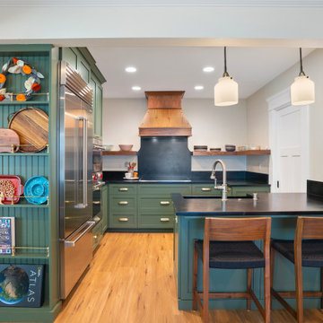 Turquoise Kitchen Cabinets and Black Marble Countertops