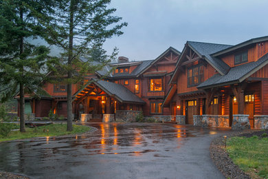 Inspiration for a rustic brown three-story wood exterior home remodel in Seattle