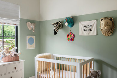 Inspiration for a contemporary gender-neutral medium tone wood floor and brown floor nursery remodel in San Francisco with multicolored walls