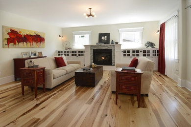 Inspiration for a mid-sized timeless open concept light wood floor and beige floor living room remodel in New York with white walls, a standard fireplace and a brick fireplace