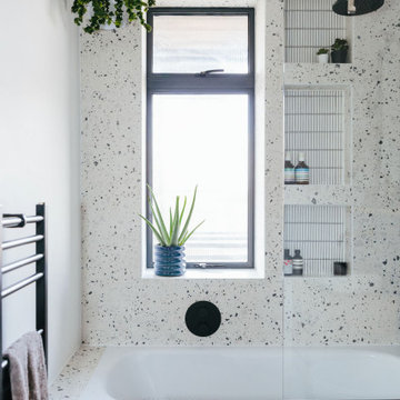 Modern terrazzo tiled bathroom with black hardware