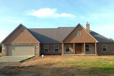 Mid-sized rustic one-story vinyl exterior home idea in Other
