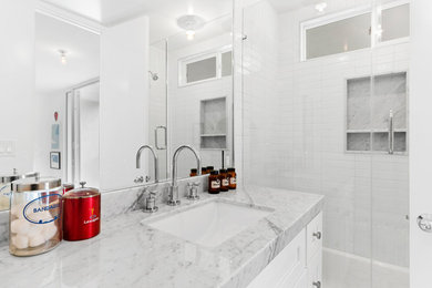 Example of a mid-century modern bathroom design in Orange County