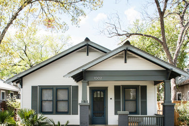 Mid-sized white one-story wood exterior home photo in Austin