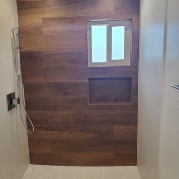 Modern Aliso Viejo Shower Renovation with Wood-Inspired Accent Wall and Rainfall