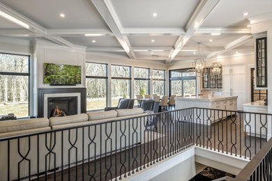Foyer - large traditional light wood floor and brown floor foyer idea with white walls and a white front door