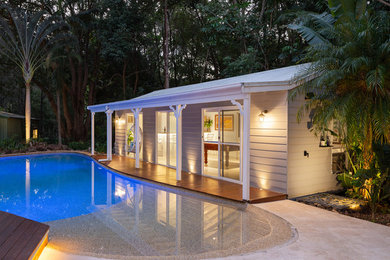 Photo of a tropical home design in Other.