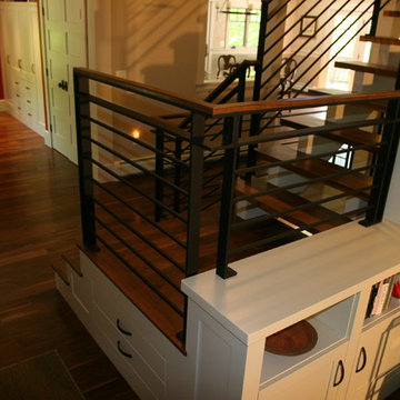 Open concept contemporary stairs with steal railing