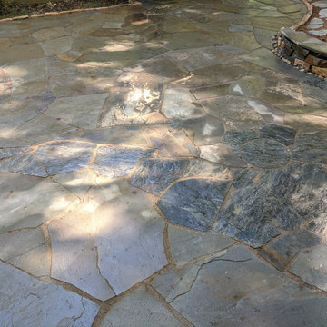 Large Irregular Bluestone Patio, Seating Wall, and Walkways Plus In Laid Design