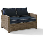 Crosley - Bradenton Outdoor Wicker Loveseat With Navy Cushions - Create the ultimate in outdoor entertaining with Crosley's Bradenton Collection. This elegantly designed all-weather wicker conversational set is the perfect addition to your environment. The finely crafted deep seating collection features intricately woven wicker over durable steel frames, and UV/Fade resistant cushions providing comfort, style and durability.