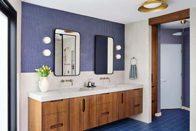 Large 1960s master blue tile and mosaic tile porcelain tile, blue floor and double-sink alcove shower photo in Chicago with louvered cabinets, brown cabinets, blue walls, an integrated sink, quartz countertops, white countertops, a floating vanity and a hinged shower door