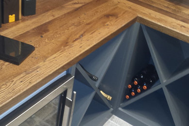 Inspiration for a small contemporary ceramic tile wine cellar remodel in Raleigh