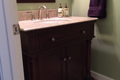 Example of a small 3/4 ceramic tile bathroom design in DC Metro with an undermount sink, shaker cabinets, dark wood cabinets and green walls