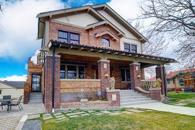 Photo of a large and red traditional brick detached house in Denver with three floors, a pitched roof, a mixed material roof, a red roof and shingles.