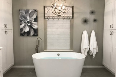 Inspiration for a small transitional kids' ceramic tile and gray floor bathroom remodel in Denver with flat-panel cabinets, white cabinets, gray walls, an undermount sink and granite countertops