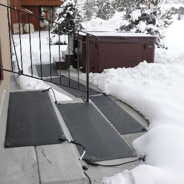 Joanne and Mike clear the path from their bedroom to their outdoor hot tub