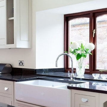 Kitchen with large Island in painted plum finish